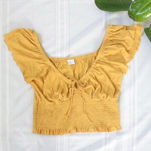 Patrons of Peace yellow smocked blouse with tie in middle